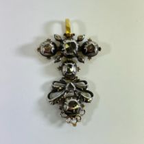 A gold and white metal baroque mine cut diamond hinged pendant, approx 4cm long and approx 7.5grams.