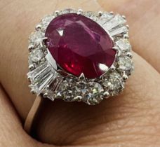 *****AWAY TO VENDOR**** A ruby and diamond set starburst design cluster ring. Featuring an estimated