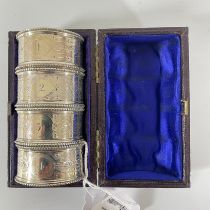 A boxed set of 4 Vietnam silver napkin rings, London 1871, numbered 1-4. Weight approx 60grams.