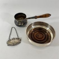 A silver Brandy warmer with turned wooden handle London 1970, a silver rim coaster approx 11cm