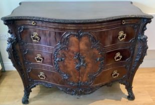 A good quality Georgian style mahogany commode chest in the Louis XV fashion with a slide above