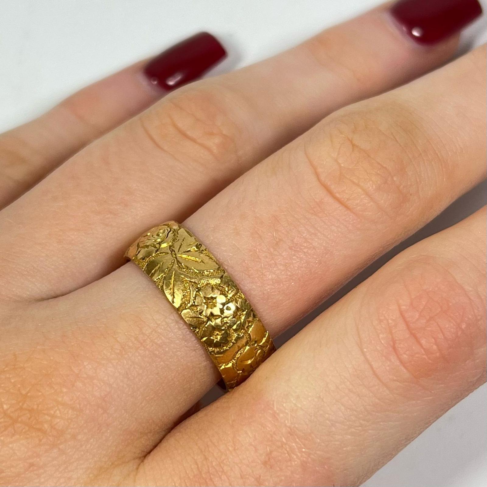 A Hallmarked 18ct yellow gold foliate engraved band ring, size T approx 9grams band width approx - Image 2 of 4