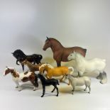 A collection of 8 Beswick Horses.