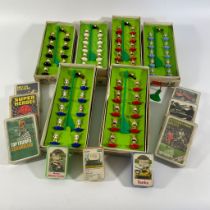 A collection of Subbuteo football teams and equipment, Top Trumps and other cards.