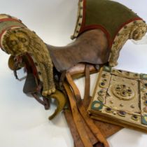 Of film interest: A saddle and book used in the 1964 film epic film "Becket", starring Peter O'