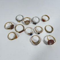 A collection of 9ct gold rings (12) in total. Including: - 375 gold diamond cluster, size 'R' -