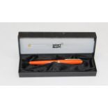A Mont Blanc Generation fountain pen, with 14ct gold nib, orange and gilt metal barrel case. Boxed