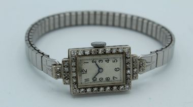 An Art Deco Certina cocktail watch, unmarked white gold case set with eight- cut diamonds