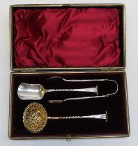 Martin, Hall and Co, a Victorian cased silver three piece sugar suite, comprising sifter, nips and
