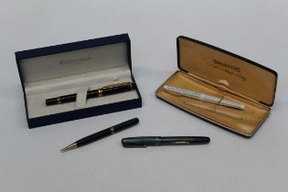 A Waterman gold mounted fountain pen in case, another Waterman fountain pen and matching pencil