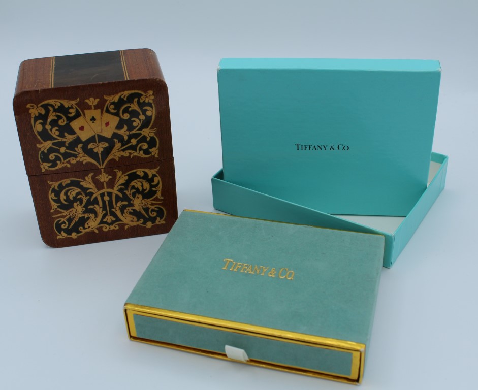 A boxed set of two decks of Tiffany and Co playing cards, together with two 2002 Commonwealth