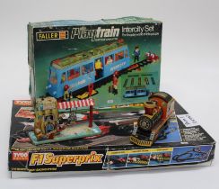 A Tyco F1 Superprix Racing system and a Faller Intercity Playtrain set. Also included are 2x