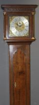 A late 18th century oak longcase clock. The twelve inch brass calendar dial with silver chapter