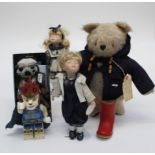 A Gabrielle teddy bear with Paddington ticket and with Paddington/ Duffle coat etc, together with
