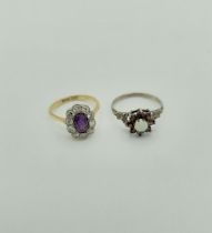 An amethyst and diamond cluster ring, stamped 18ct and plat, size O1/2. Gross weight 3.4gm featuring