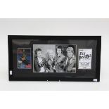 The Sex Pistols, a black and white photograph signed in black ink by all four band members, with