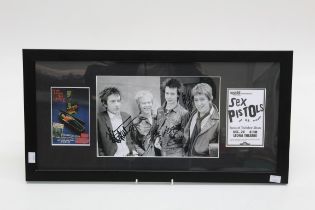 The Sex Pistols, a black and white photograph signed in black ink by all four band members, with