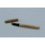 A 9ct gold Parker 51 Presential fountain pen. Hallmarks for London 1961/1962, 14cm