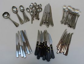 A David Mellor steel canteen comprising eight table knives, eight side knives, eleven wooden handled