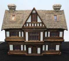A Tudor Dolls Houses Doll's House by Robert Stubbs. Hand crafted as a thatched cottage with