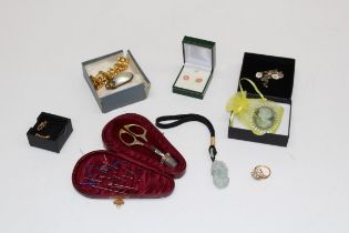 A small quantity of costume jewellery, jade pendant, Edwardian needlework case and other items