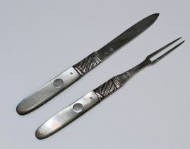 A late George III mother of pearl and silver travelling knife and fork, each with a monogrammed