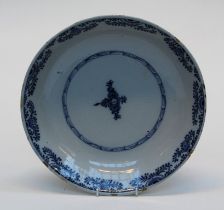 A Dutch Delftware dish of good size, early 19th century, simply decorated underglaze with florets