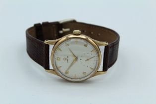 A mid 20th century Omega 9 carat gold cased Gentleman's wristwatch. 15 jewel movement numbered