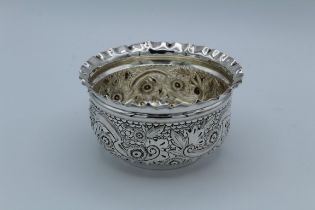 Henry Harrison, a Victorian silver sugar basin with crimped rim and floral repousse decorated