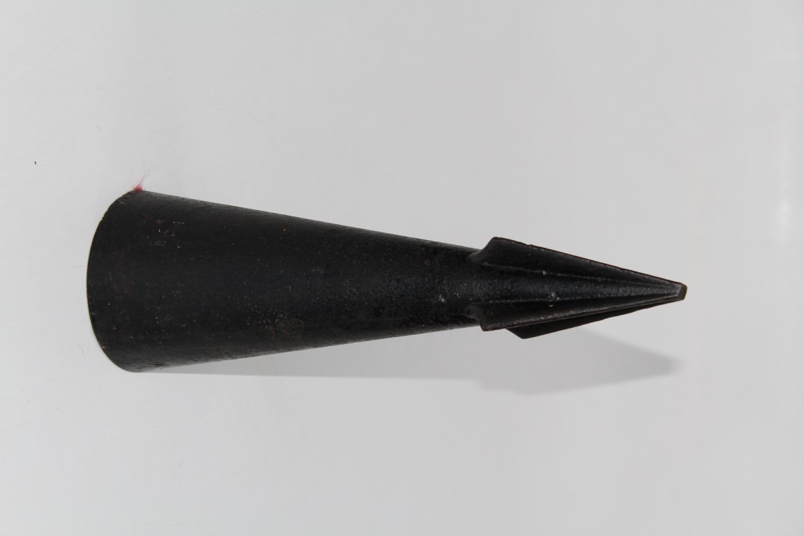 A mid 20th century explosive-fired harpoon head, cast steel with four flukes and threaded base.