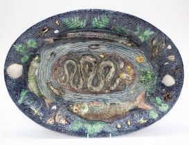 A large Pallisy - type majolica charger, early 20th century. The central coiled snake facing a frog,