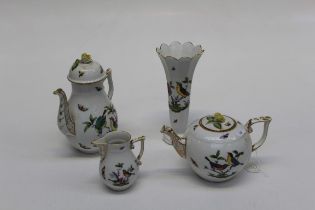 A group of Herend porcelain, including tea and coffee pots, cream jug and trumpet form vase. Each