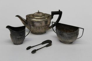 A three piece Victorian silver bachelors teaset comprising a teapot, sugar basin, milk jug ,