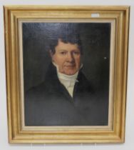 Early 19th century French School A half length portrait of a gentleman in a dark coat wearing an