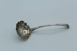 George W Adams, a Victorian silver sifter spoon with shaped bowl, bell flower cast reeded handle and