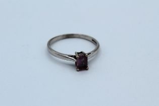 An 18ct white gold pink sapphire solitaire ring. Set with an octagon cut pink sapphire. Estimated