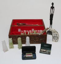 A set of onyx chessmen in carved wood box, a Benin-type bronze figure, a reproduction scrimshaw,