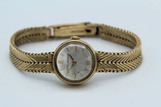 Jaeger Le Coultre, a lady's 9 carat gold wristwatch. Movement numbered 1711184. Silvered 2cm dial