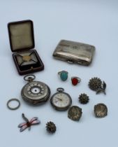 A collection of silver watches and jewellery comprising three rings, two pairs of clip earrings,