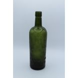 J and W Hardie, Edinburgh. A circa 1900's olive green mallet form Whiskey bottle, 27cm