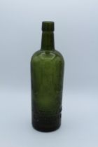 J and W Hardie, Edinburgh. A circa 1900's olive green mallet form Whiskey bottle, 27cm