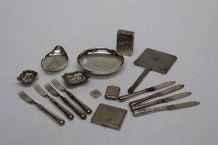 A set of four silver fish knives and forks, London 1964, a silver backed hand mirror, two silver