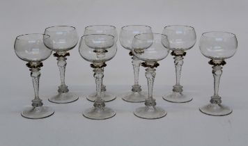 A set of eight mid 20th century hand blown hock glasses, each with plain bowl, applied tinted collar