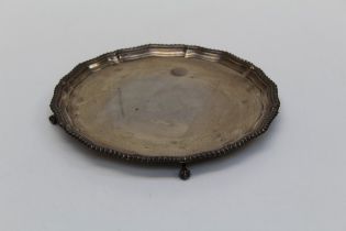 Barker Brothers Ltd, an Elizabeth II silver salver, with gadrooned rim, on four talon and ball feet.