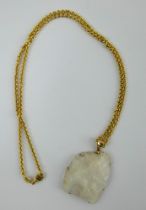 White quartz and 9ct gold pendant on a 9ct yellow gold chain. Pendant 3.5cm x 3 cm. Chain 55cm