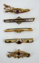 Five antique gem set 9ct gold bar brooches including an opal, amethyst, garnets and seed pearls.