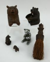 Five Black Forest carved wood bears including an inkwell and brush, and a heavy chromed brass bear