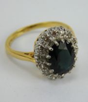 An 18ct gold sapphire and diamond cluster ring