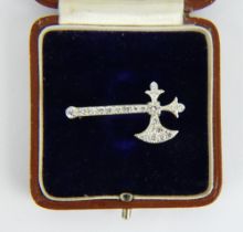 A diamond encrusted brooch in the form of an axe