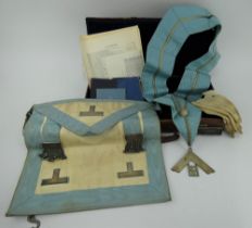 1950s masonic case and contents including white metal mounted apron and sash, books, gloves etc.